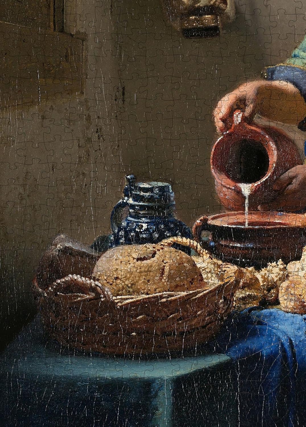 The Milkmaid by Vermeer puzzle: milk pouring and bread close-up