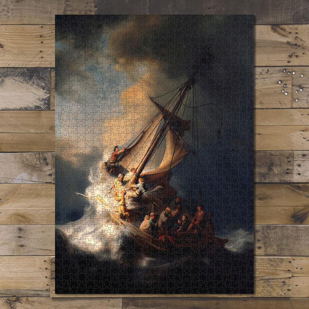 Storm on the Sea of Galilee puzzle: completed puzzle on wooden tabletop