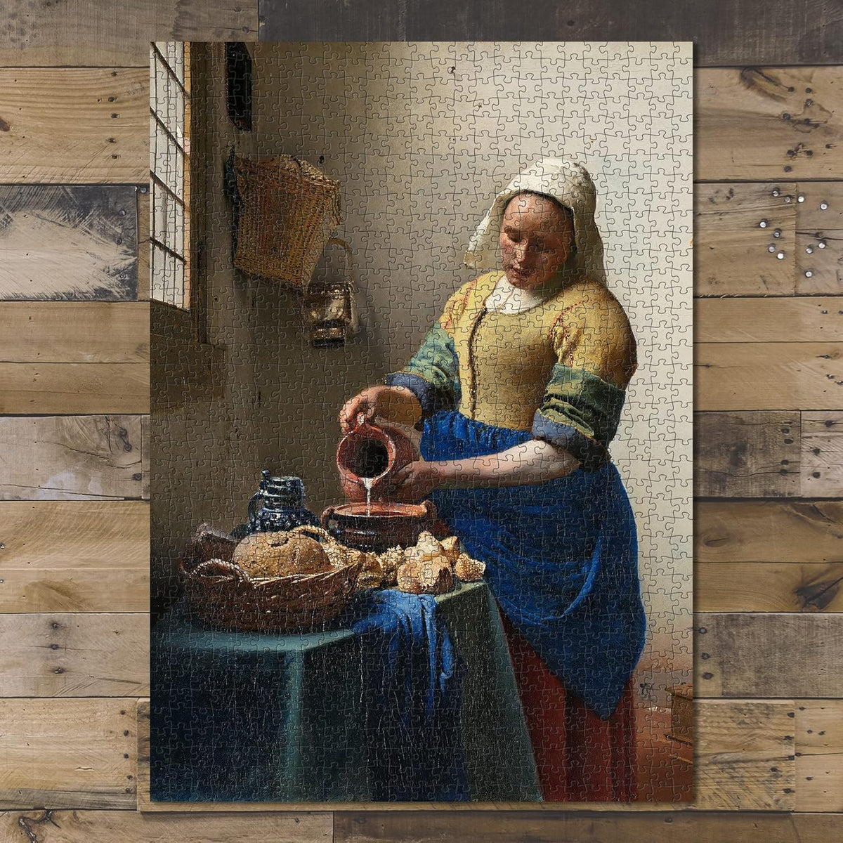 The Milkmaid by Vermeer puzzle: completed puzzle on wooden tabletop