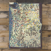Pacific Northwest Pictorial Map puzzle: completed puzzle on wooden tabletop