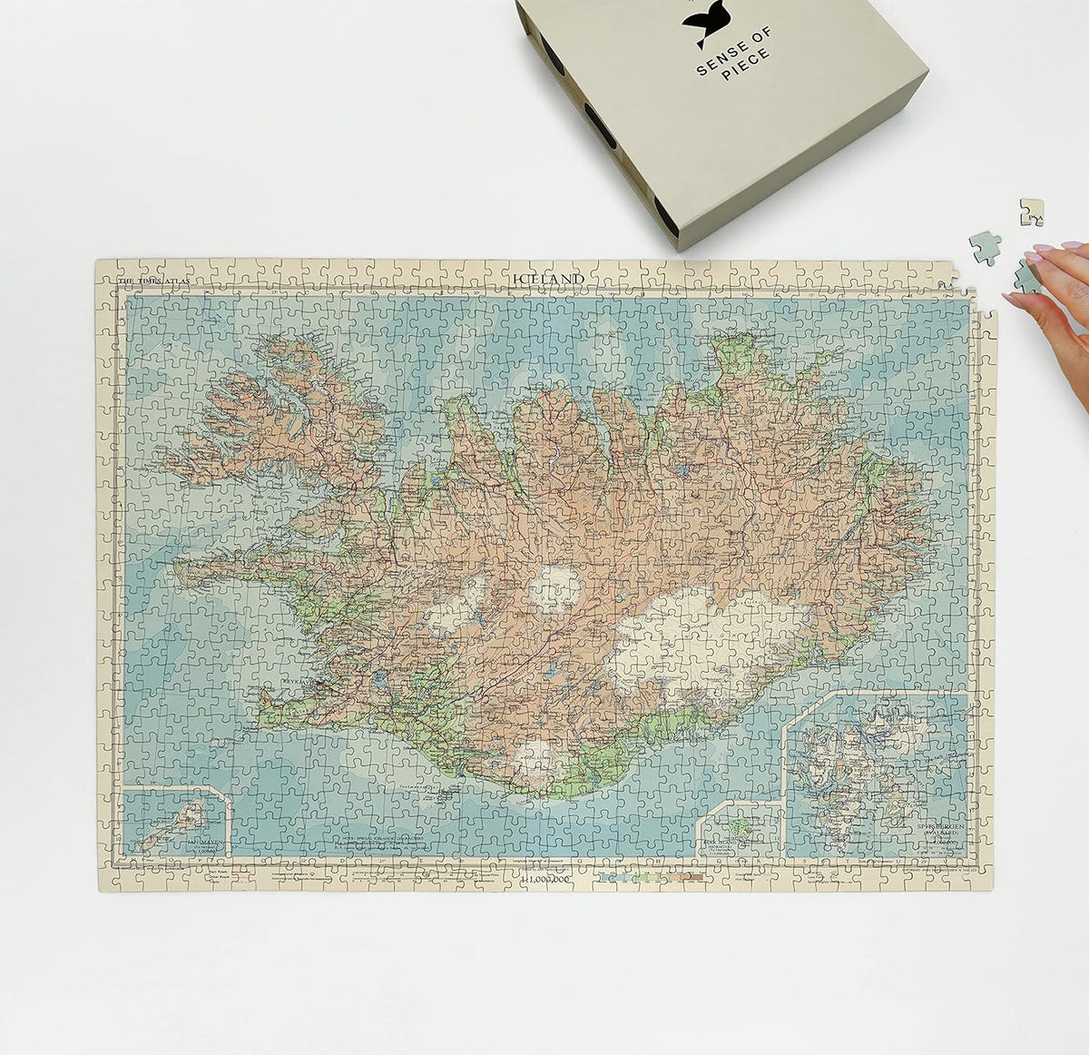 Iceland Atlas Map puzzle: puzzle and box on white tabletop