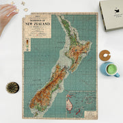 New Zealand Map puzzle: puzzle and box on white tabletop