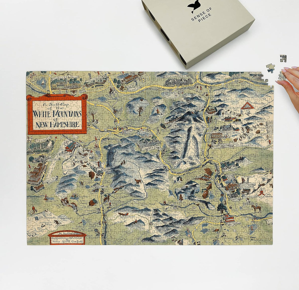 White Mountains New Hampshire Map puzzle: puzzle and box on white tabletop