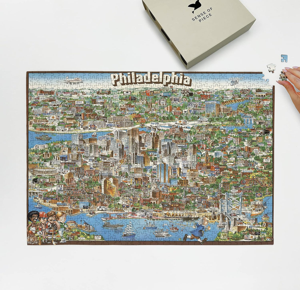 Philadelphia Illustrated City Map puzzle: puzzle and box on white tabletop