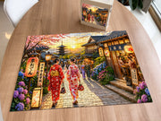 Kyoto Street at Sunset puzzle: completed puzzle on wooden table beside its box
